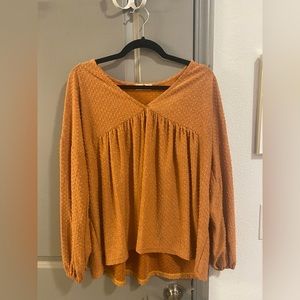 large pale orange textured blouse
